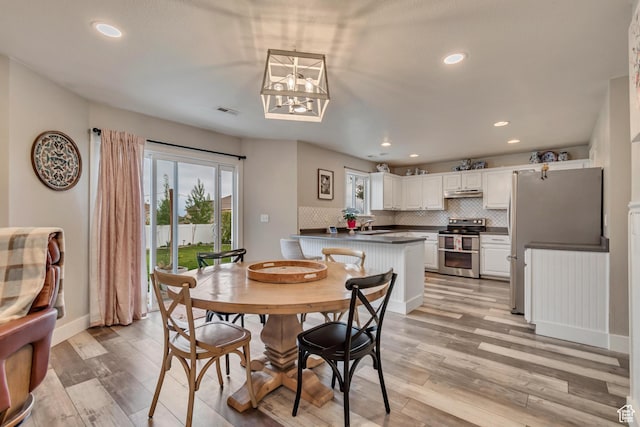 13623 S Blayde Dr W, Herriman, UT 84096 - dining area featuring a wealth of natural light, recessed lighting, light wood-style flooring, and visible vents