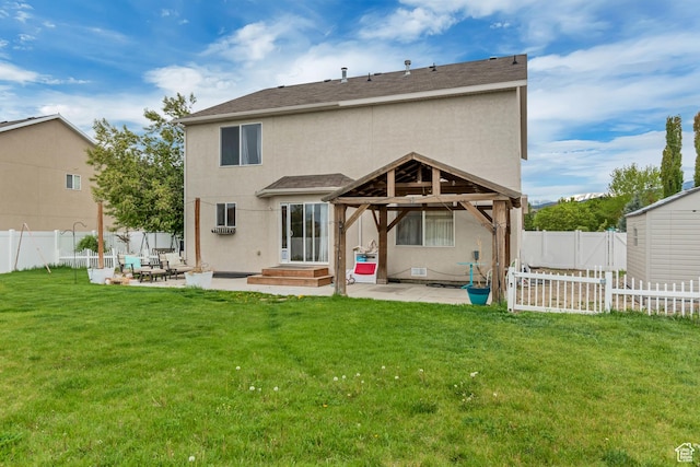 13623 S Blayde Dr W, Herriman, UT 84096 - rear view of house featuring a lawn, a gazebo, a patio, and stucco siding