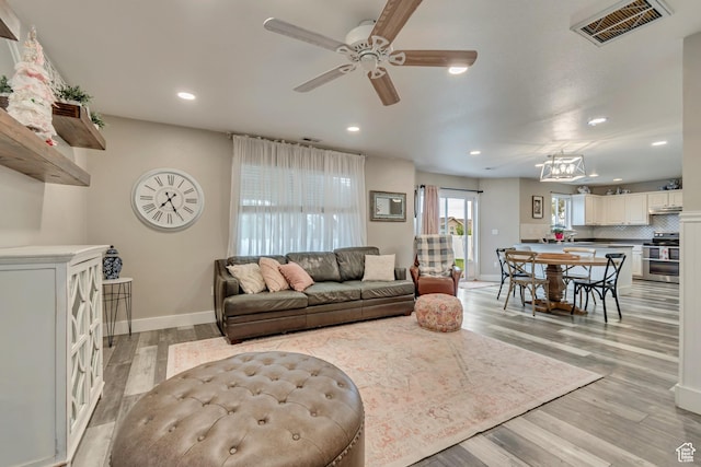 13623 S Blayde Dr W, Herriman, UT 84096 - living area with ceiling fan, light wood-type flooring, visible vents, and recessed lighting