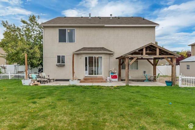 13623 S Blayde Dr W, Herriman, UT 84096 - back of property with a fenced backyard, a gazebo, a patio area, and stucco siding