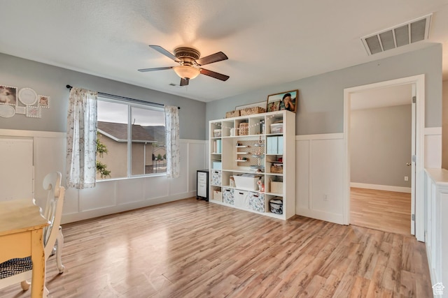 13623 S Blayde Dr W, Herriman, UT 84096 - unfurnished room featuring ceiling fan, wainscoting, visible vents, and wood finished floors