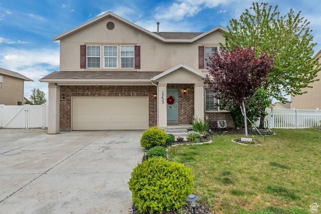 13623 S Blayde Dr W, Herriman, UT 84096 - traditional-style house featuring a front yard, driveway, an attached garage, and fence