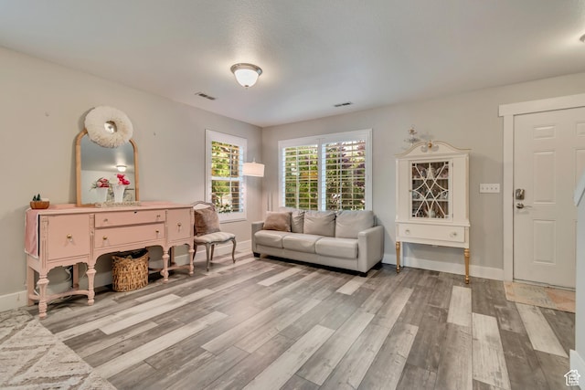 13623 S Blayde Dr W, Herriman, UT 84096 - living room featuring visible vents, wood finished floors, and baseboards