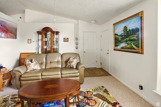 carpeted living area with lofted ceiling, baseboards, and a textured ceiling