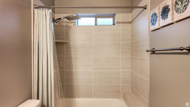 bathroom with shower / bath combo with shower curtain