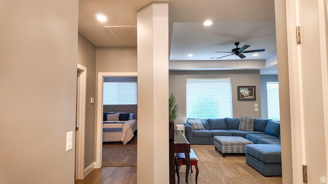 living room featuring a ceiling fan, recessed lighting, and wood finished floors