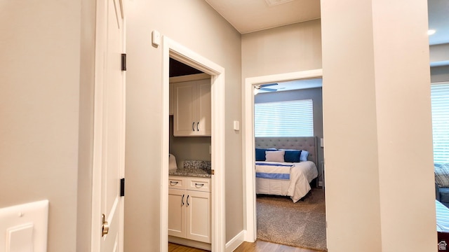 hallway featuring light wood-style flooring