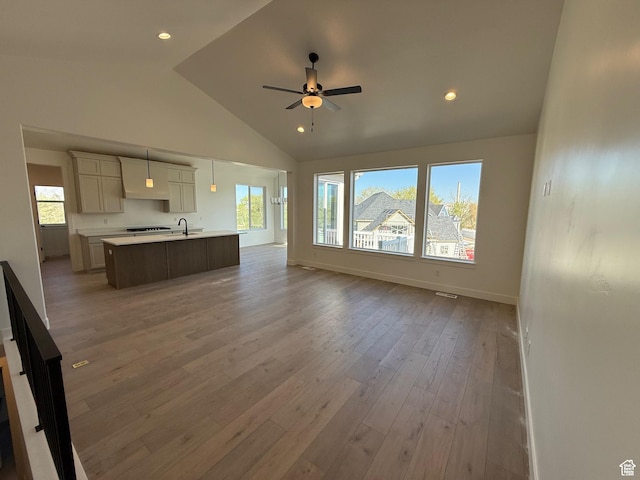 1336 W 800 S Unit 22, Spanish Fork, UT 84660 - living area with baseboards, a ceiling fan, plenty of natural light, and light wood-style floors