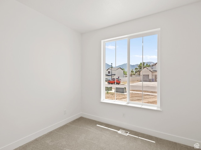 1336 W 800 S Unit 22, Spanish Fork, UT 84660 - spare room with a mountain view and carpet flooring