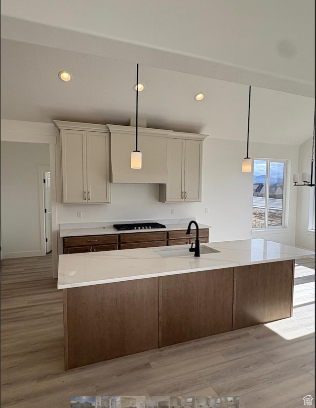 285 N 990 E Unit 13, Salem, UT 84653 - kitchen featuring a sink, gas cooktop, light wood-type flooring, decorative light fixtures, and recessed lighting