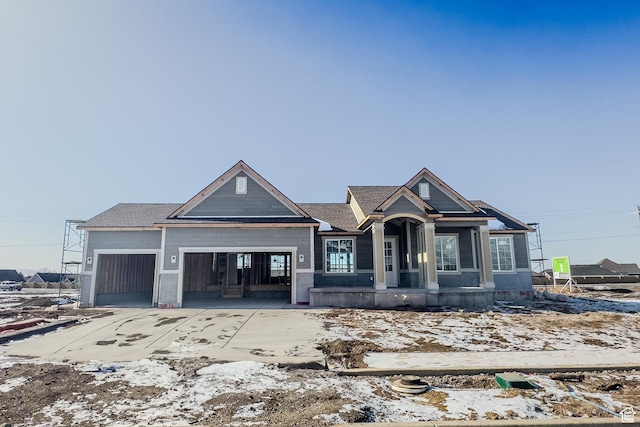 view of front of property with driveway and an attached garage