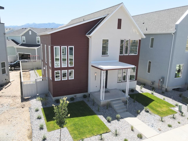 6967 W Lake Ave S Unit 324, South Jordan, UT 84009 - view of front facade with a mountain view and stucco siding