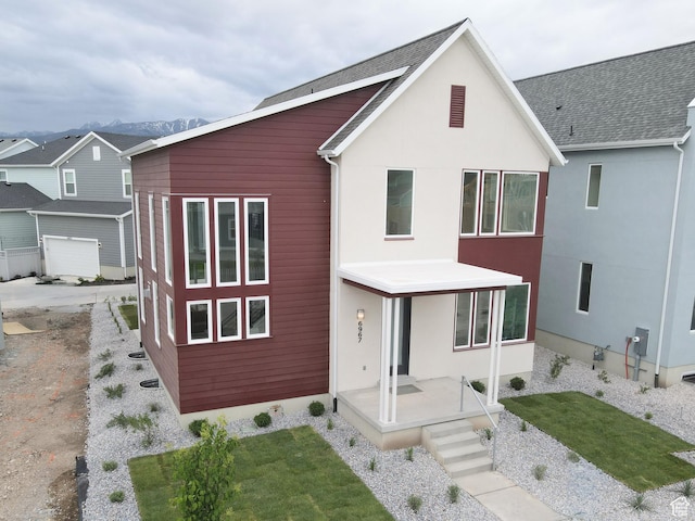 6967 W Lake Ave S Unit 324, South Jordan, UT 84009 - contemporary house with a front lawn and stucco siding