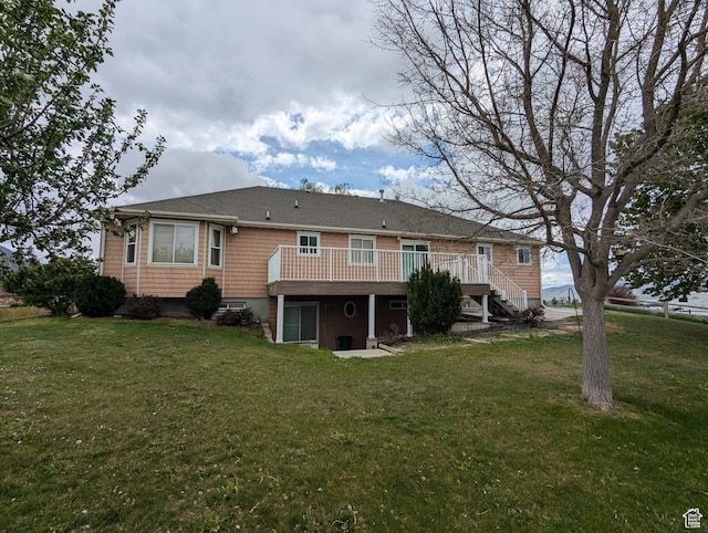565 E Platt Ln Unit 1, Mona, UT 84645 - back of property featuring a lawn, a deck, and stairway