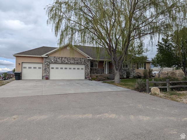 565 E Platt Ln Unit 1, Mona, UT 84645 - single story home featuring fence, an attached garage, stone siding, and driveway