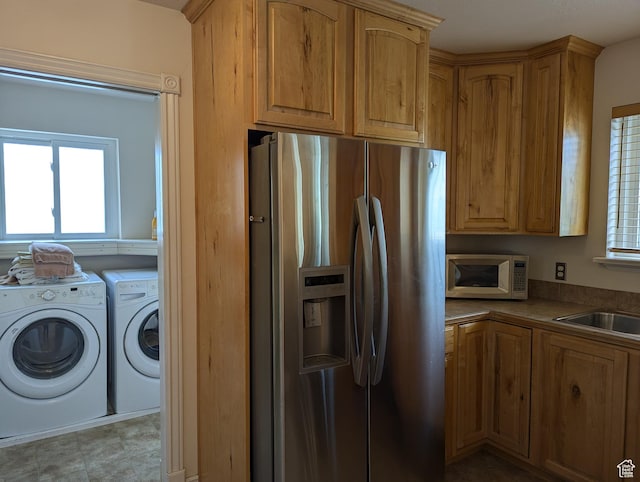 565 E Platt Ln Unit 1, Mona, UT 84645 - kitchen with stainless steel appliances, separate washer and dryer, and a sink