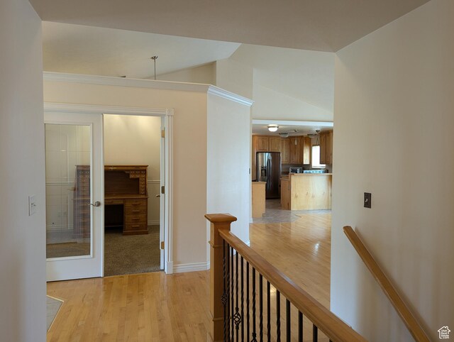 565 E Platt Ln Unit 1, Mona, UT 84645 - hall with baseboards, an upstairs landing, lofted ceiling, and light wood-style flooring