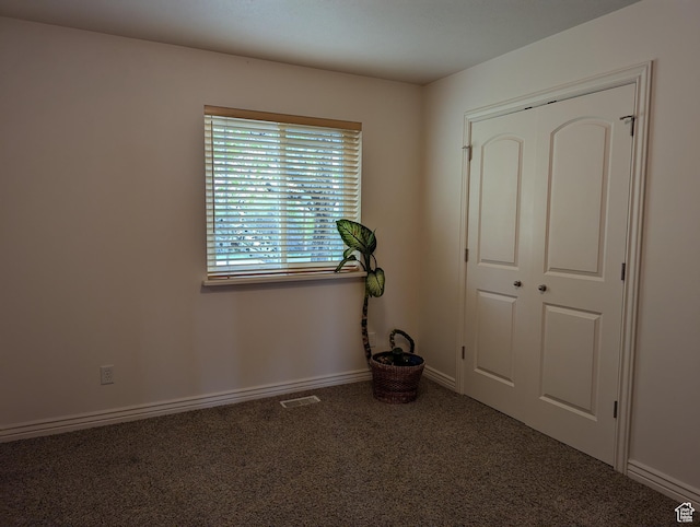 565 E Platt Ln Unit 1, Mona, UT 84645 - interior space with carpet, visible vents, baseboards, and a closet