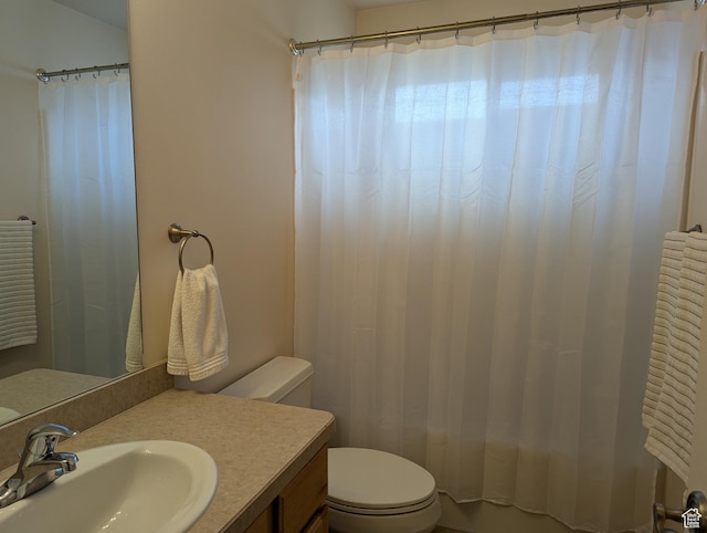 565 E Platt Ln Unit 1, Mona, UT 84645 - bathroom with shower / bath combo with shower curtain, toilet, and vanity
