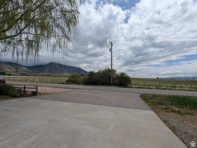 565 E Platt Ln Unit 1, Mona, UT 84645 - view of street with concrete driveway and a mountain view