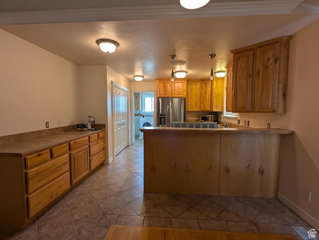 565 E Platt Ln Unit 1, Mona, UT 84645 - kitchen featuring a peninsula, a sink, stainless steel refrigerator with ice dispenser, tile patterned flooring, and baseboards