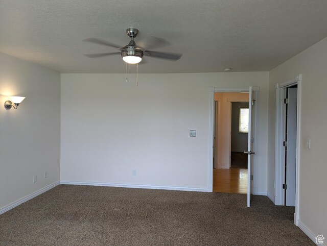 565 E Platt Ln Unit 1, Mona, UT 84645 - carpeted spare room with baseboards and a ceiling fan