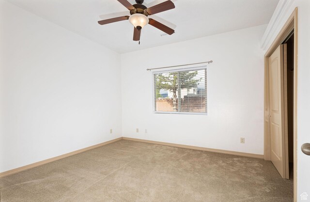 396 W 1500 N, Enoch, UT 84721 - unfurnished bedroom with light colored carpet, baseboards, and a ceiling fan