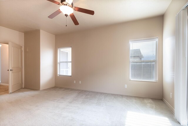396 W 1500 N, Enoch, UT 84721 - spare room featuring light colored carpet, baseboards, and a ceiling fan