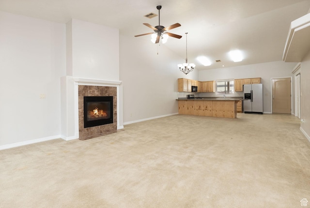396 W 1500 N, Enoch, UT 84721 - unfurnished living room with baseboards, light carpet, visible vents, and ceiling fan with notable chandelier