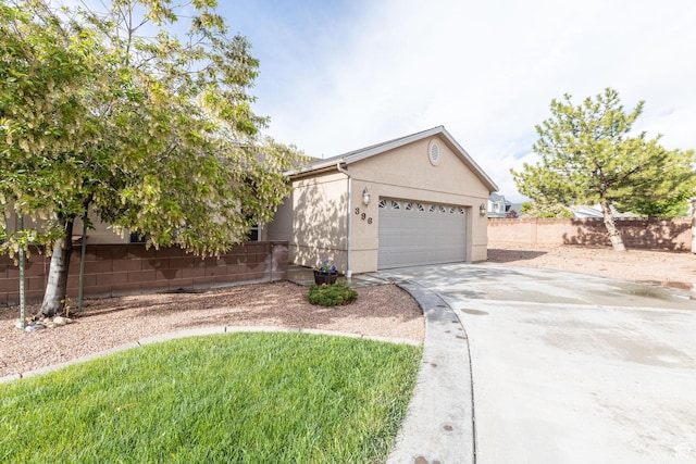 396 W 1500 N, Enoch, UT 84721 - ranch-style home with driveway, stucco siding, an attached garage, and fence