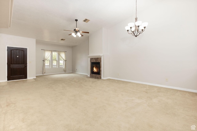 396 W 1500 N, Enoch, UT 84721 - unfurnished living room with a tile fireplace, ceiling fan with notable chandelier, light carpet, visible vents, and vaulted ceiling
