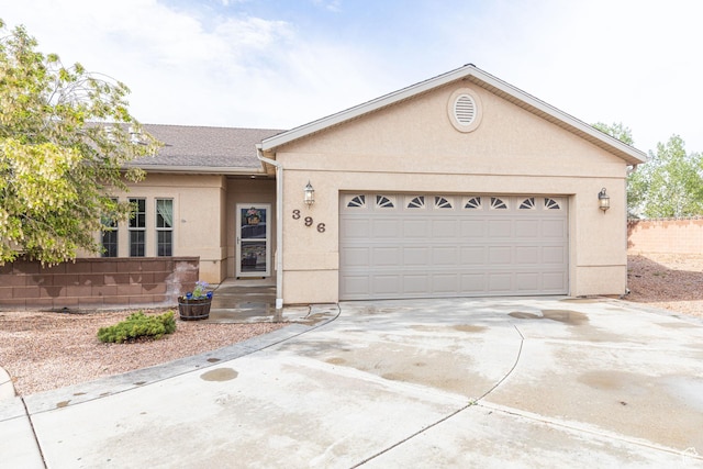 396 W 1500 N, Enoch, UT 84721 - ranch-style home with concrete driveway, an attached garage, and stucco siding