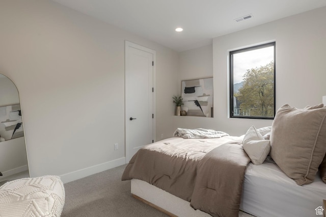carpeted bedroom with baseboards, recessed lighting, and visible vents