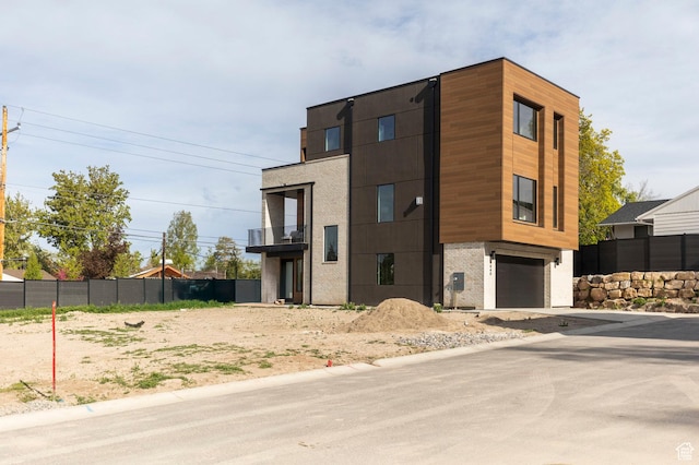 contemporary home featuring a garage and driveway
