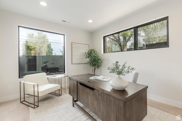 office space with visible vents, baseboards, light wood-style flooring, and recessed lighting