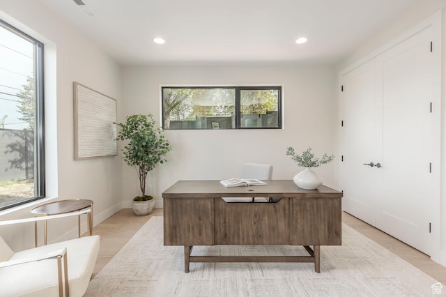 home office featuring baseboards, a healthy amount of sunlight, and recessed lighting