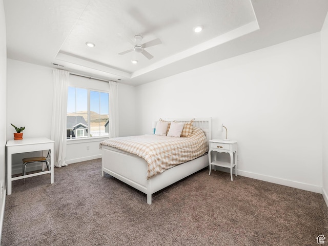bedroom featuring baseboards, a raised ceiling, carpet flooring, and recessed lighting