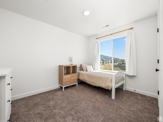 bedroom featuring carpet, baseboards, and visible vents