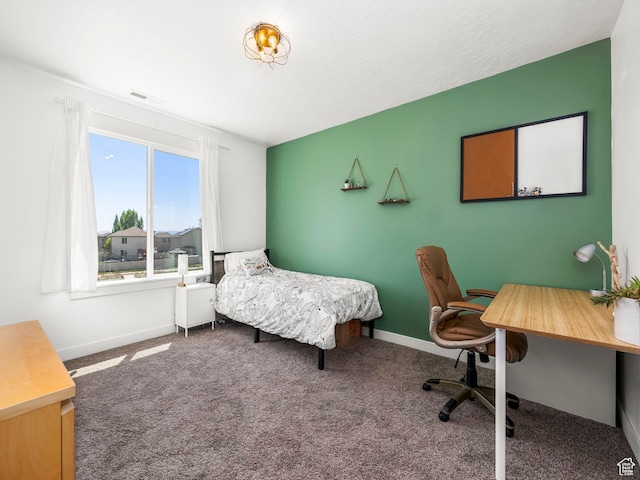 carpeted bedroom with baseboards and visible vents