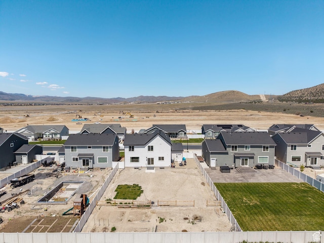 bird's eye view featuring a mountain view and a residential view