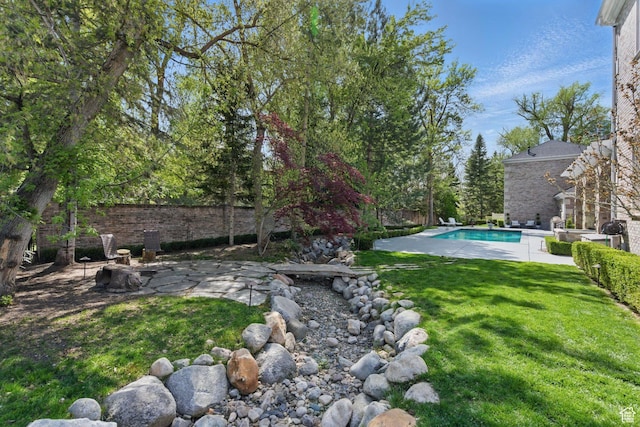 2428 E Field Rose Dr, Holladay, UT 84121 - view of yard with a patio area, fence, and an outdoor pool