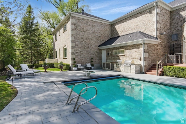 2428 E Field Rose Dr, Holladay, UT 84121 - outdoor pool featuring an outdoor kitchen, a patio, and grilling area