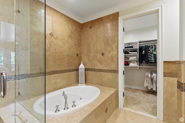 2428 E Field Rose Dr, Holladay, UT 84121 - bathroom with a stall shower, a walk in closet, a bath, tile walls, and crown molding