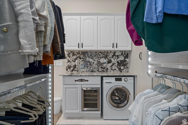 2428 E Field Rose Dr, Holladay, UT 84121 - laundry room with cabinet space, light tile patterned floors, washer / dryer, and beverage cooler