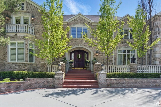 2428 E Field Rose Dr, Holladay, UT 84121 - view of front facade with brick siding and french doors