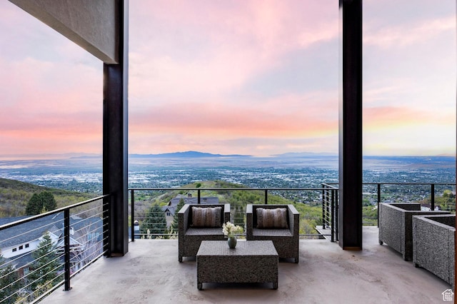 view of balcony at dusk