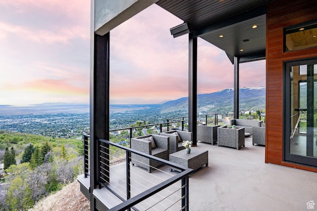 balcony featuring an outdoor living space and a mountain view