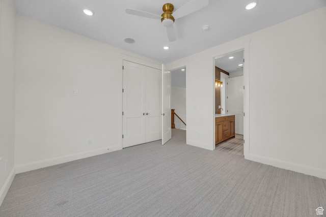 unfurnished room with light colored carpet, baseboards, a ceiling fan, and recessed lighting