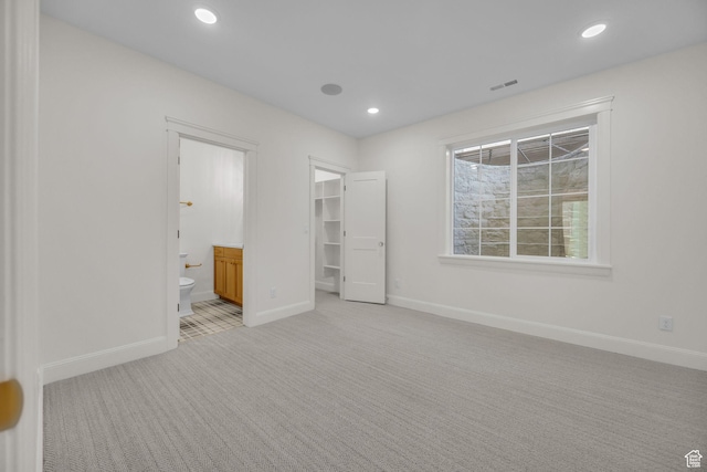 1358 S 1220 E, Salem, UT 84653 - unfurnished bedroom with light carpet, baseboards, a walk in closet, recessed lighting, and ensuite bath