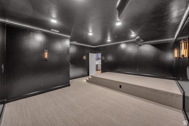 home theater room with baseboards, carpet floors, ornamental molding, and recessed lighting